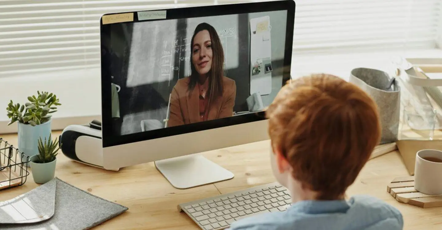Ginger kid in front of a screen
